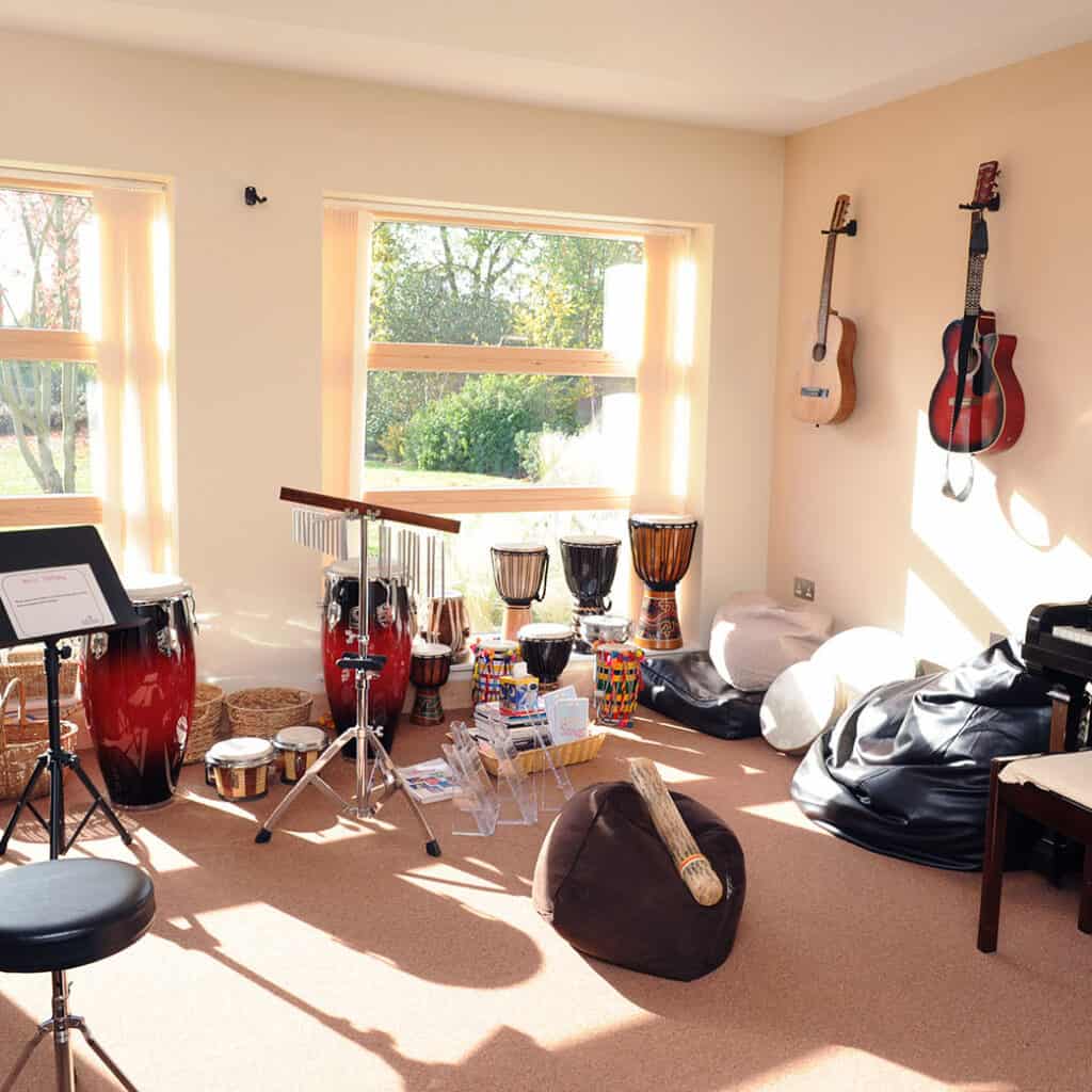 Music room full of instruments at Shooting Star House