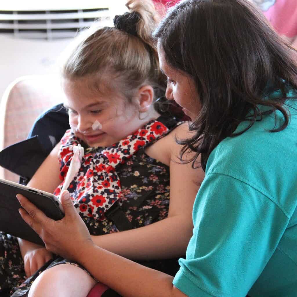 Young girl at enjoying the Festival of Music at hospice