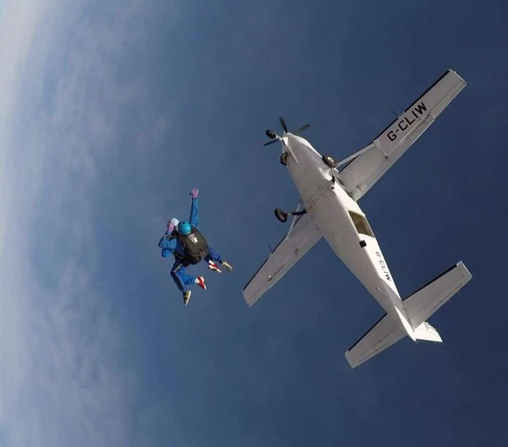 Person skydiving out of a plane