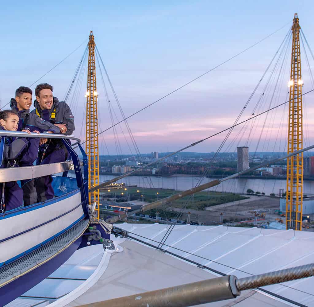 Family looking out from the top of the 02 arena at sunset