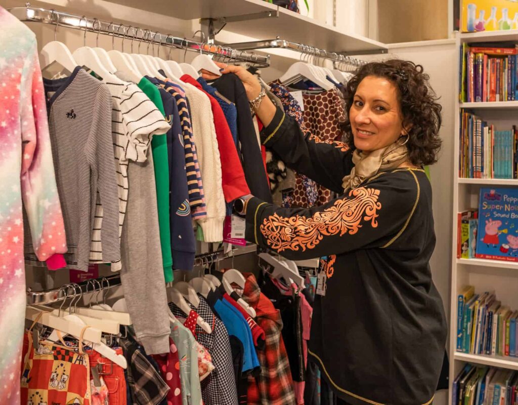 Woman sorting clothes at our charity shops