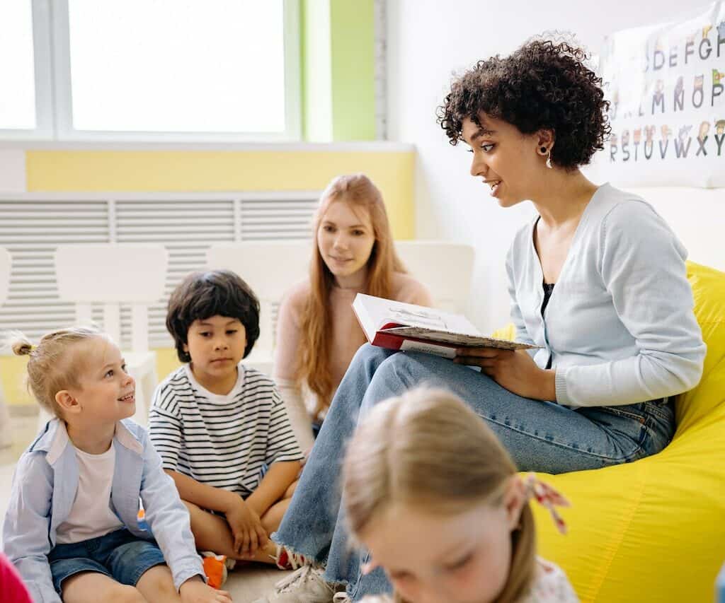 A Teacher and children at a nursery