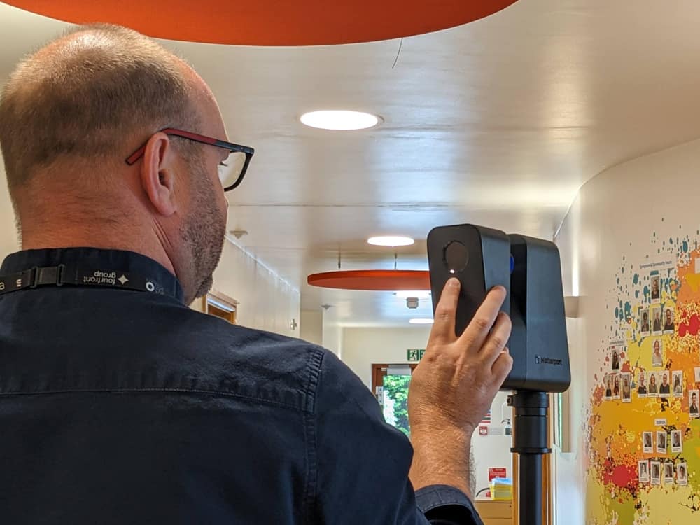 A person filming the hospice using a 360 camera