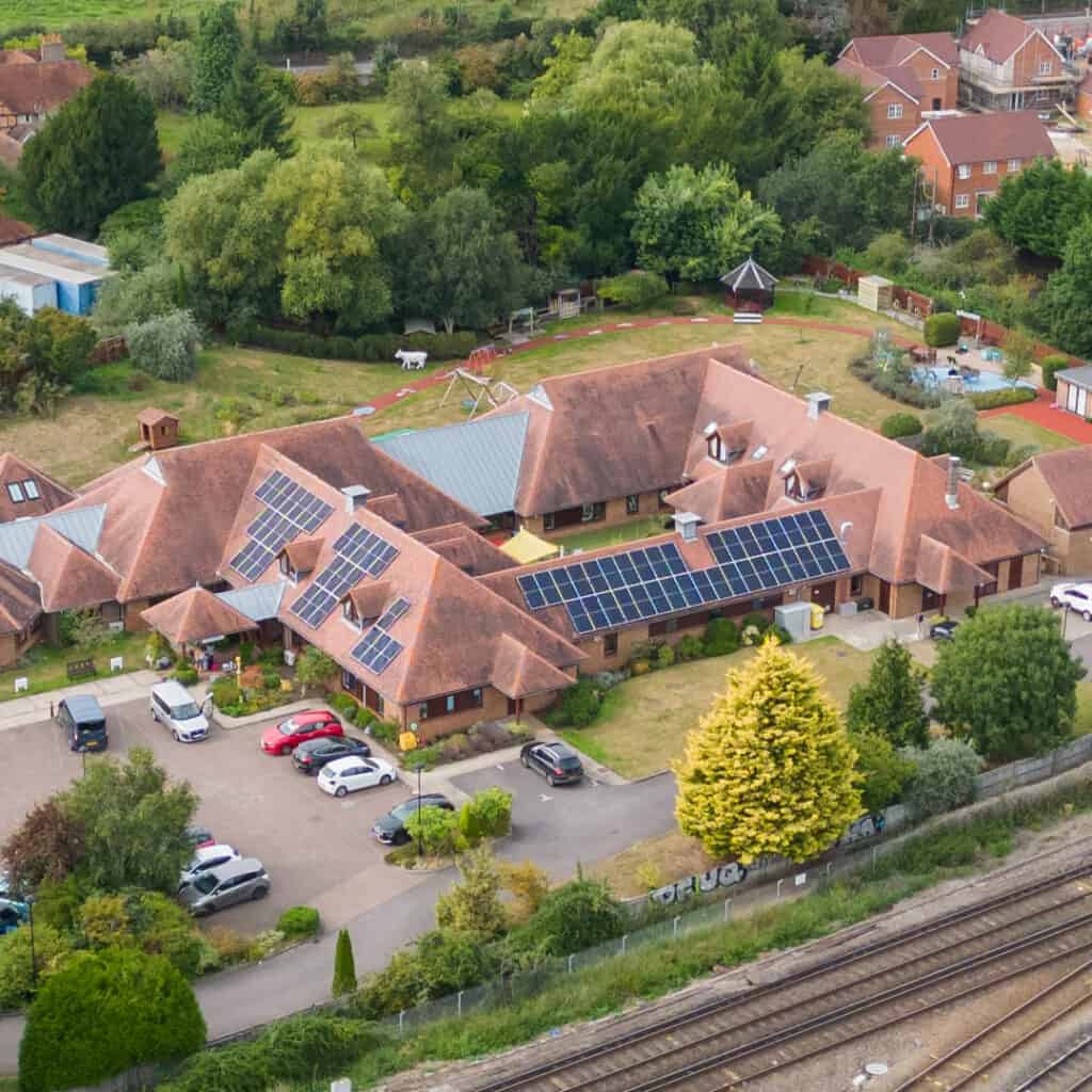 Aerial photos of Christopher's hospice with new solar panels on its roof.