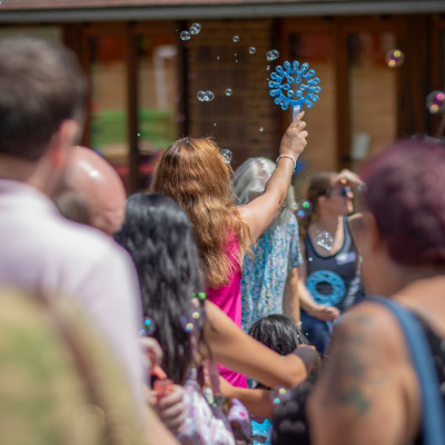 Families creating bubbles as part of Shooting Star's Memory Day.