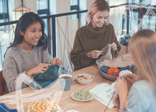 A group of people knitting and talking