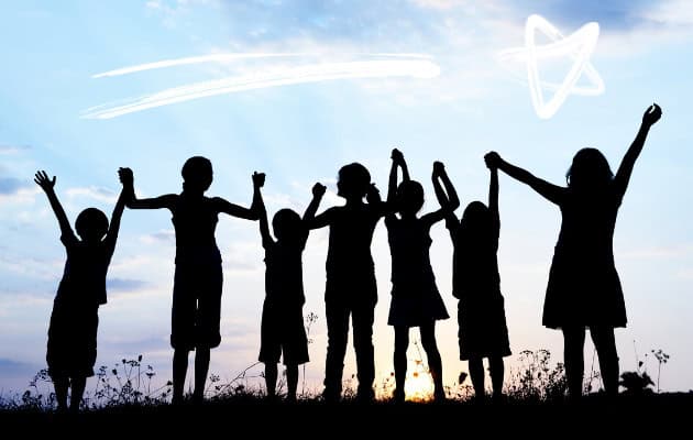 A group of children holding hands